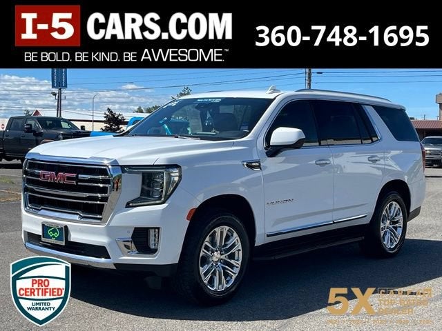 2024 GMC Yukon SLT in Summit White — front three-quarter view