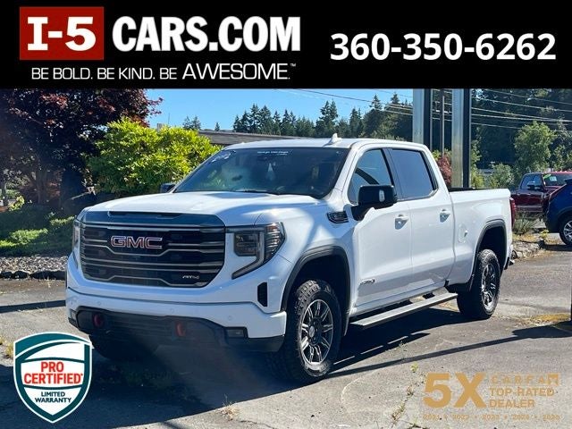 2024 GMC Sierra 1500 AT4 in Summit White — front three-quarter view