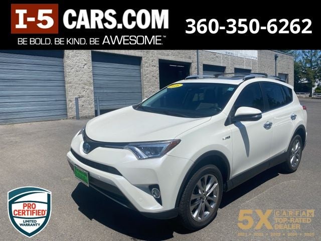 2016 Toyota RAV4 Hybrid Limited in Blizzard Pearl — front three-quarter view
