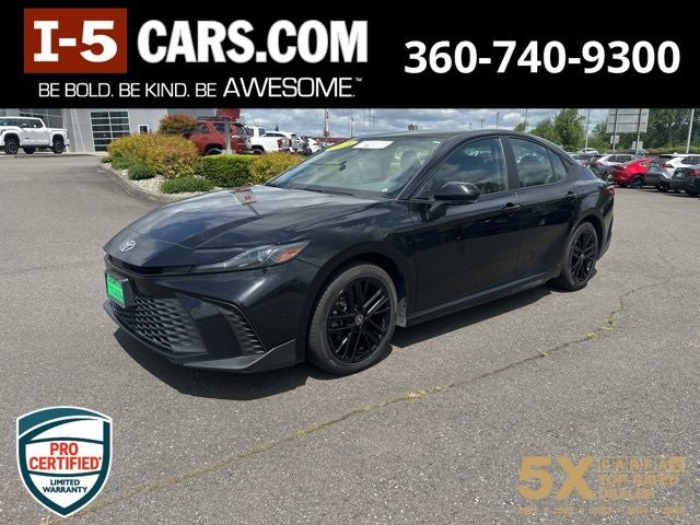 2025 Toyota Camry SE in Midnight Black Metallic — front three-quarter view