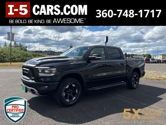 2022 RAM 1500 Rebel Crew Cab 4x4 5'7' Box in Diamond Black Crystal Pearlcoat — front three-quarter view