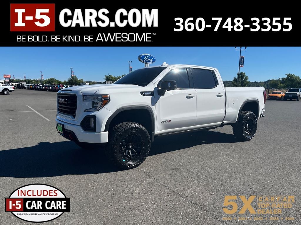 2021 GMC Sierra 1500 AT4 in Summit White — front three-quarter view